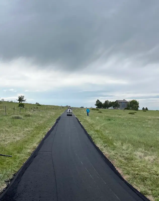 Long asphalt driveway in Monument being installed